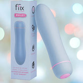 The Femme Funn FFIX Bullet Vibrator - Blue is showcased alongside its packaging, which emphasizes features such as "10 Powerful Settings," "Waterproof," and a "30 Day Warranty." A soft blur of multicolored lights provides a gentle, inviting backdrop.